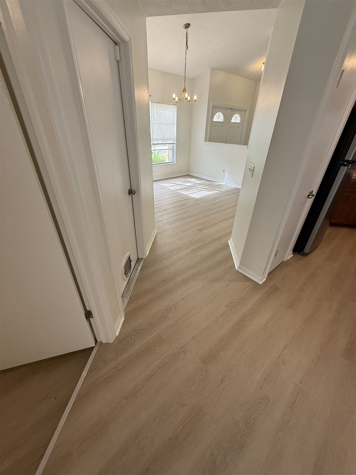Interior remodel with chandelier and new flooring by 3DCON LLC