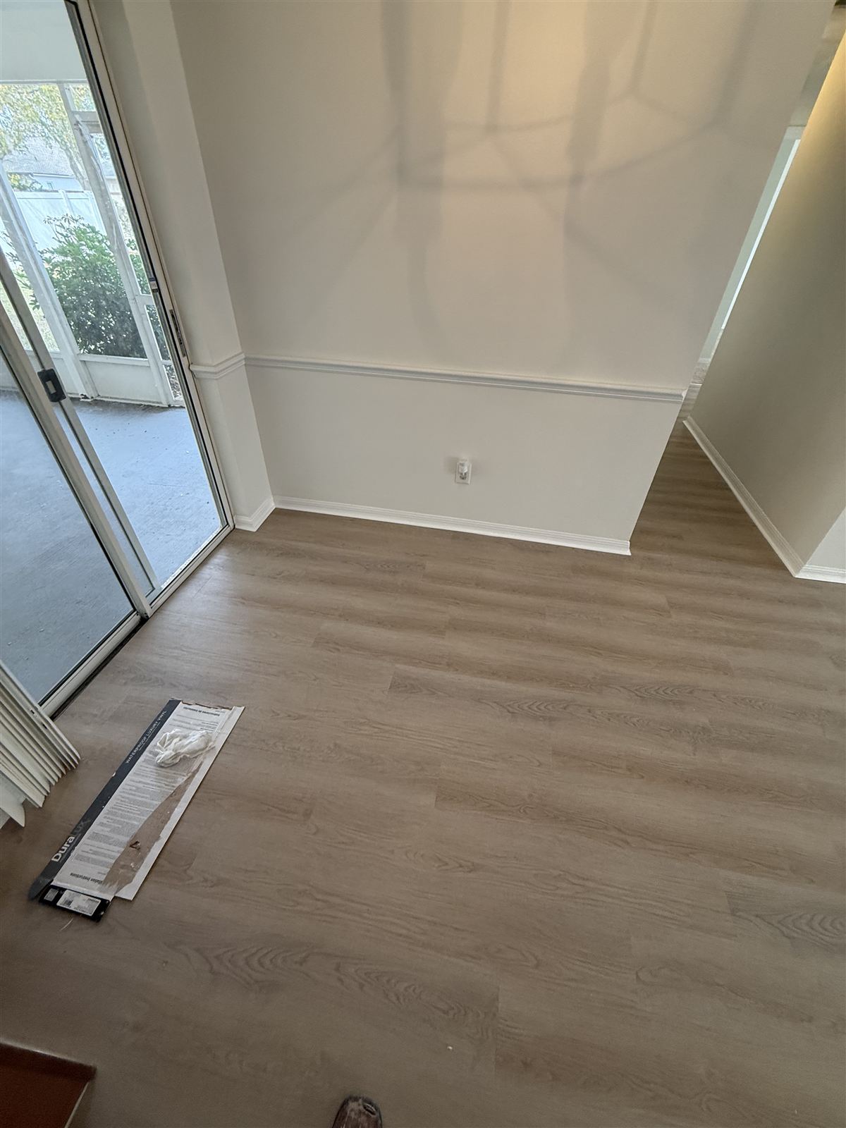 Room remodel with luxury vinyl plank flooring by 3DCON LLC