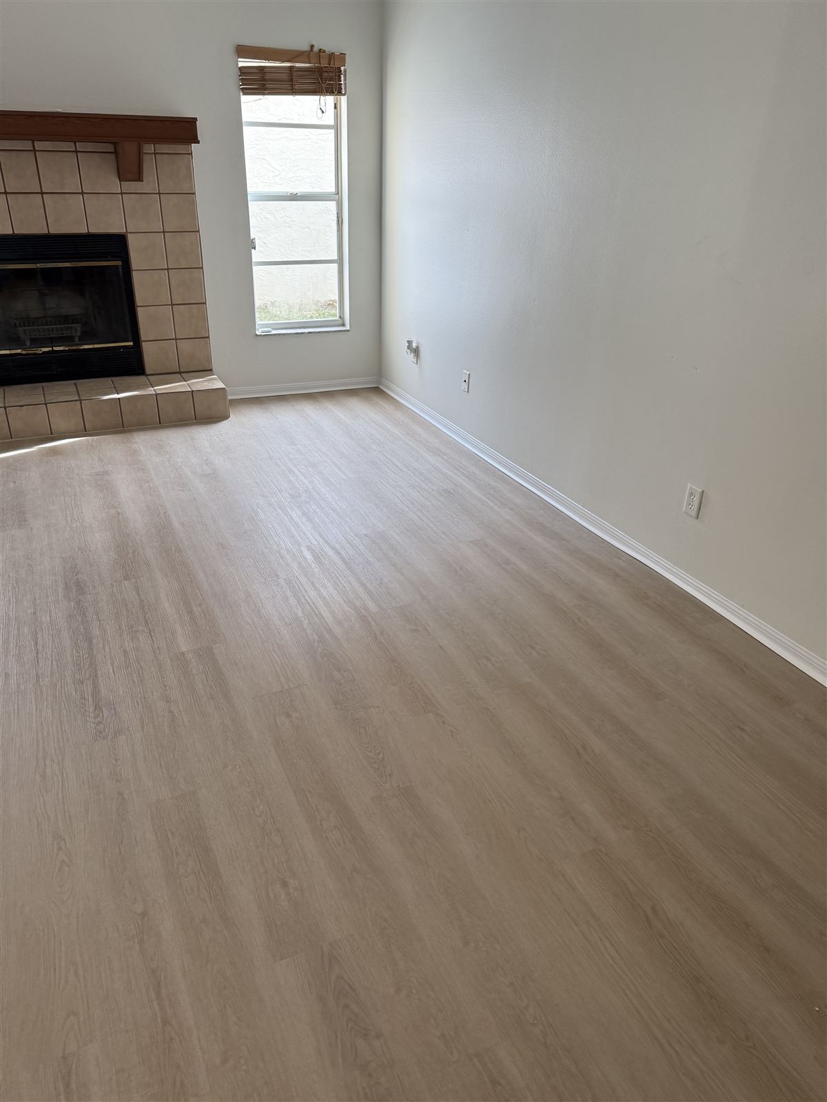 Living room remodel with fireplace and new flooring by 3DCON LLC