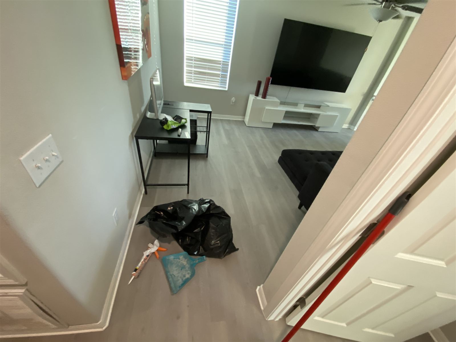 Living room remodel with new luxury vinyl flooring by 3DCON LLC