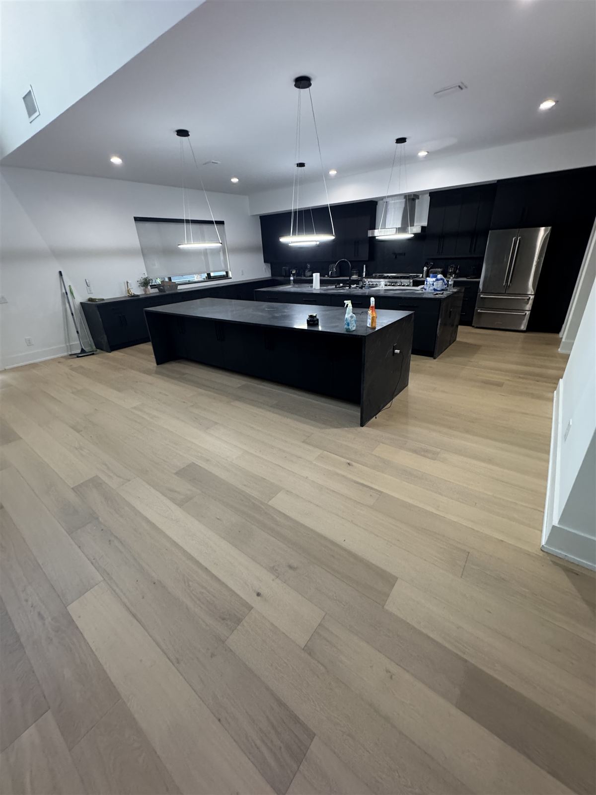 Kitchen remodel with island and pendant lighting by 3DCON LLC