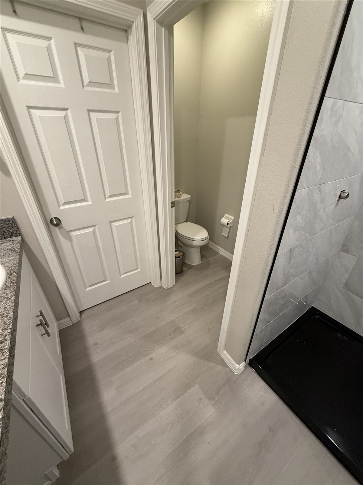 Bathroom remodel with tiled shower by 3DCON LLC