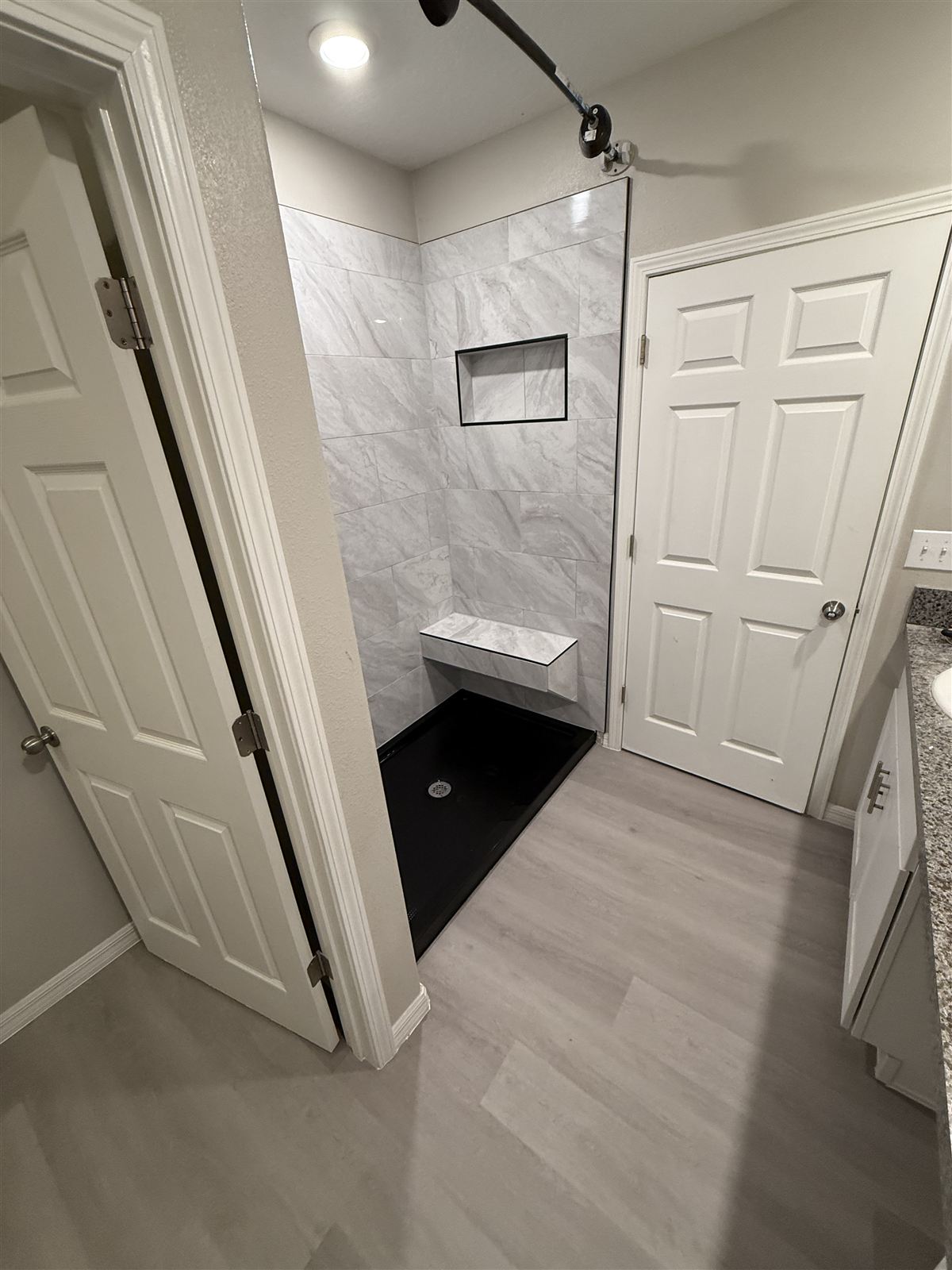 Marble walk-in shower bathroom remodel by 3DCON LLC in Brandon, FL